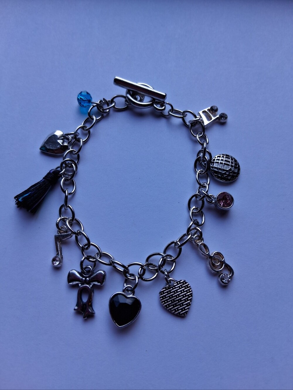 Hand Crafted Silver Charm Bracelet with Black and Blue Accents
